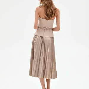 Abito tortora con top bustier e gonna plissé