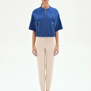 Capospalla cropped blu brillante con zip dorate
