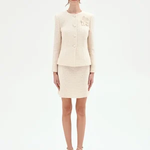 Giacca bouclé beige chiaro con fiore applicato