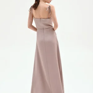 Abito lungo atelier rosa antico con drappeggio laterale