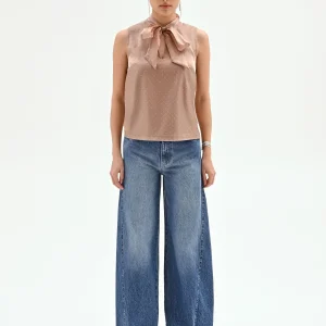 Top marrone bronzo con fiocco e punti luce